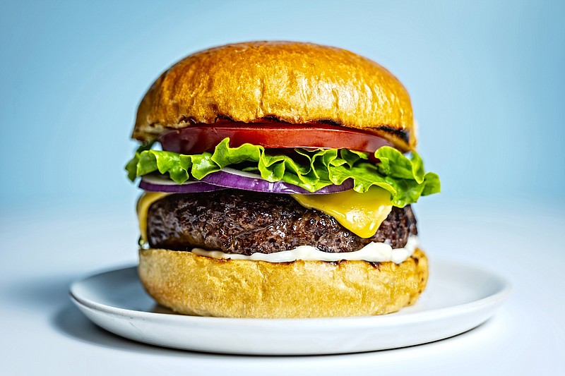 You want a burger thick enough not to dry out, but not so thick that you can't get your mouth around the dressed-up sandwich. Photo for The Washington Post by Scott Suchman