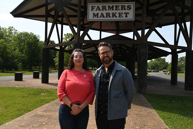Liz Colgrove, Program Director for the Hot Springs Area Cultural Alliance, and Arkansas Shakespeare Theatre Managing Director Chad Bradford share details about the upcoming Shakespeare in the Market. - Photo by Lance Brownfield of The Sentinel-Record.
