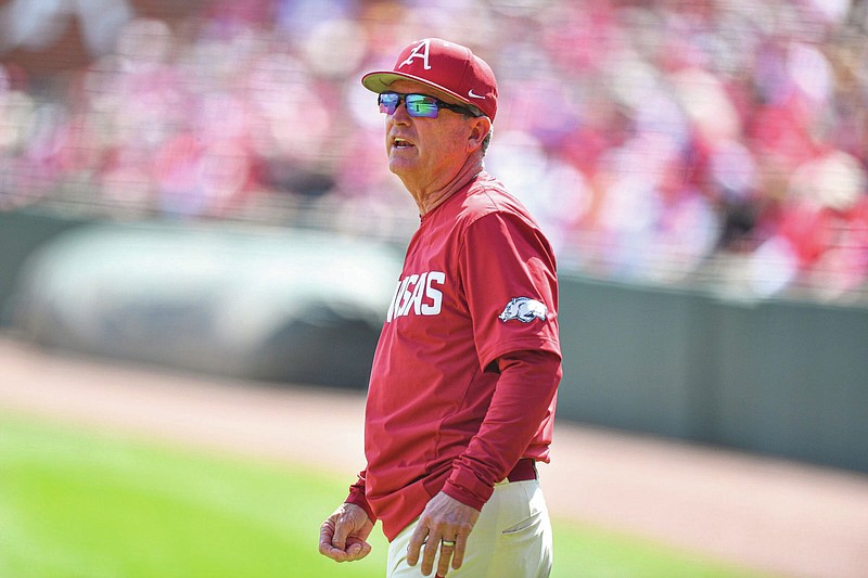 Arkansas head coach Dave Van Horn speaks with an umpire on Sunday, April 2, 2023, during the first inning of the Razorbacks 5-4 series-clinching win over Alabama at Baum-Walker Stadium in Fayetteville, Ark. (Photo by Hank Layton/NWA Democrat-Gazette)