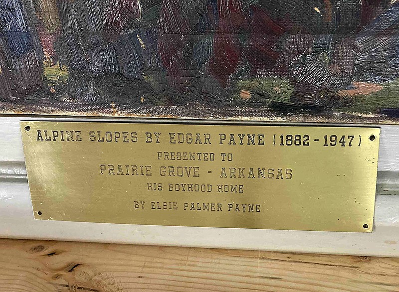 Submitted photo
This is the plaque on a painting by Edgar Alwin Payne that shows the painting was donated to the city of Prairie Grove by his widow, Elsie Palmer Payne, probably in 1862.