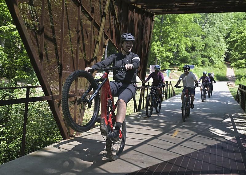 Industry bike leaders ride, Monday, May 22, 2023 at the Coler Mountain Bike Preserve in Bentonville. Runway Bike Group gave bike industry leaders a biking tour through Coler with the hopes of attracting their business to the area. (NWA Democrat-Gazette/Charlie Kaijo)
