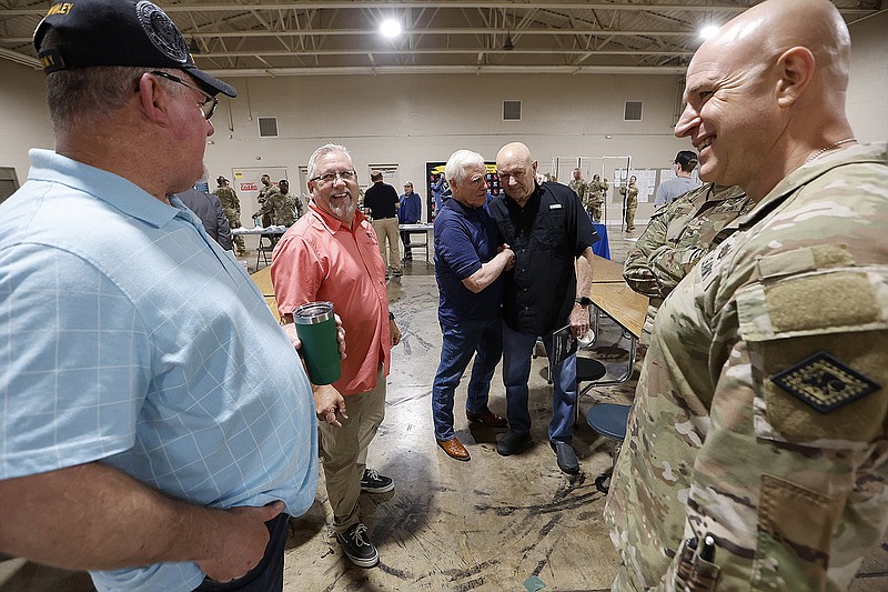 Maj. Gen. Jonathan Stubbs (right), Adjutant General of the Arkansas National Guard, talks with retired veterans Ferrell Whaley (from left), Doug Gentry, Tom Thomas and John Cox during the Arkansas National Guards All Services Roll Call on Tuesday, May 23, 2023, at the Searcy Armory.
(Arkansas Democrat-Gazette/Thomas Metthe)