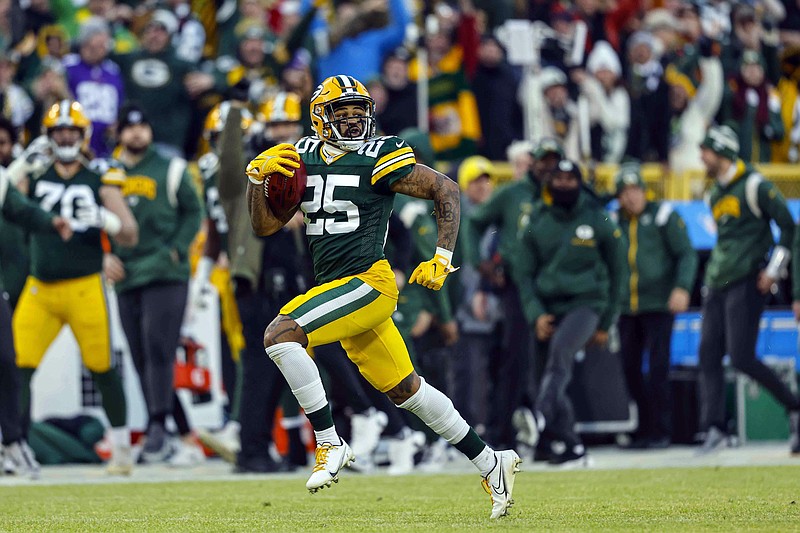 Green Bay Packers cornerback Keisean Nixon (25) runs back a kickoff for a touchdown during an NFL football game against the Minnesota Vikings Sunday, Jan. 1, 2023, in Green Bay, Wis. The NFL has pushed the kickoff return further toward irrelevance with a priority on player safety. League owners voted Tuesday, May 23, 2023, for a one-year trial of an enhanced touchback rule that will give the receiving team the ball at its own 25 with a fair catch of a kickoff anywhere behind that yard line.  (AP Photo/Jeffrey Phelps)
