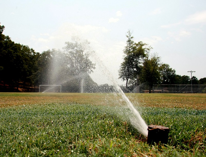 Central Arkansas Water is urging customers to avoid using their sprinkler systems between 5:30 and 7:30 a.m. so the neighbors' water pressure isn't compromised. (Democrat-Gazette file photo)
