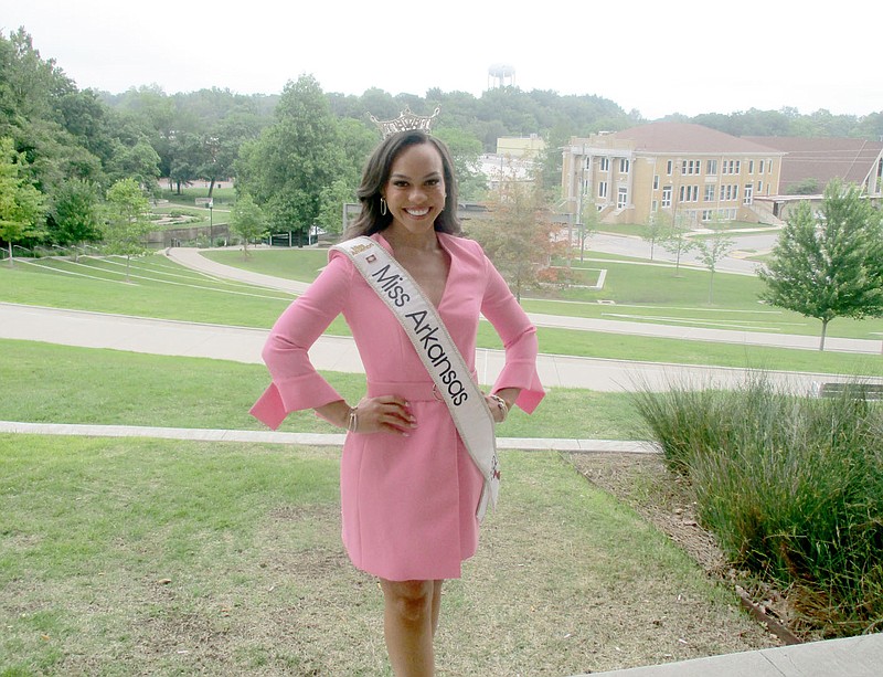 Marc Hayot/Herald-Leader Miss Arkansas Ebony Mitchell poses at Memorial Park. Mitchell is finishing out her year as Miss Arkansas and took the time to look back at her life-changing year.