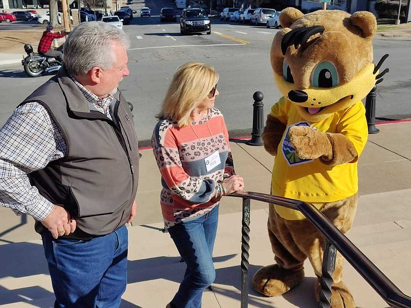 Union County Judge Mike Loftin and his wife, Phena, discuss litter prevention with Otto the Otter, who is the mascot for Keep Arkansas Beautiful. (Courtesy of Mike Loftin/Special to the News-Times)