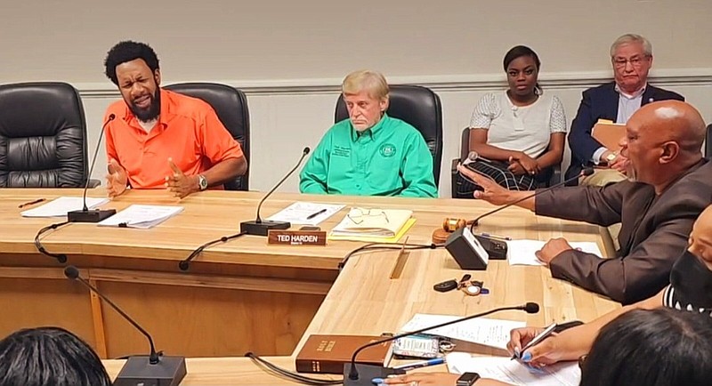 Justice of the Peace Lloyd Franklim Jr. (left) and Jefferson County Judge Gerald Robinson disagree during Tuesday's QUorum Court meeting over the Policy and Procedure Ordinance. (Pine Bluff Commercial/Eplunus Colvin)