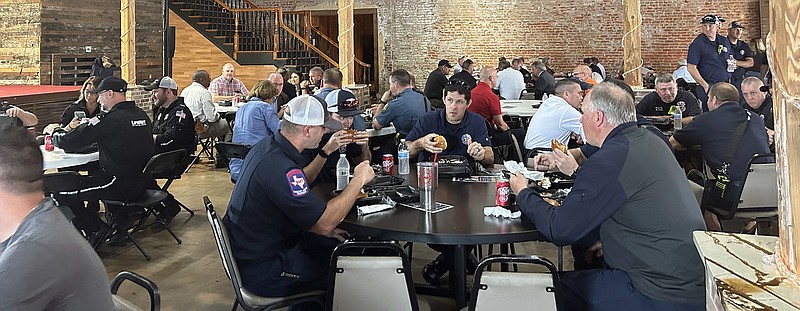 First responders enjoy lunch provided by Big Jake's BBQ on Wednesday, May 24, 2023, at Crossties in downtown Texarkana, Arkansas, during the eighth annual EMS Appreciation Day event. (Staff photo by Sharda James)