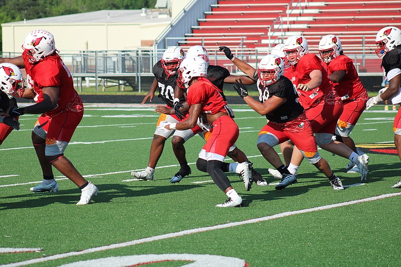 Photo By: Michael Hanich
Camden Fairview running back Jaden Porchia runs through an open hole at the line of scrimmage in the Red vs White Scrimmage.