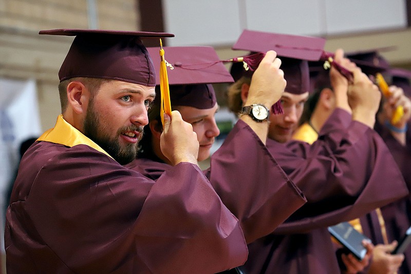 Aaron Warriner of Pine Bluff and other student-athletes from the South Arkansas College baseball team move their tassels from right to left to signify graduation. (Courtesy of Heath Waldrop/Special to the News-Times)