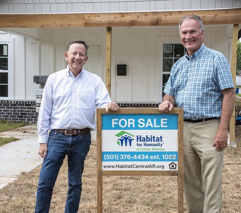 Roger Marlin (left), outgoing board president of Habitat for Humanity for Central Arkansas, and incoming president Rich Dunlap visit a Habitat Humanity Home nearing completion on West 10th St. in North Little Rock.

(Arkansas Democrat-Gazette/Cary Jenkins)