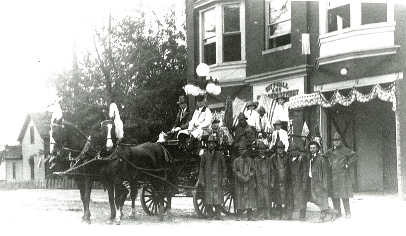 Photo courtesy the Kingdom of Callaway Historical Society: 
The first fire wagon crew preparing for a parade in front of the Fulton City Hall and Fire Department building at 4th & Market Streets, c.1900.