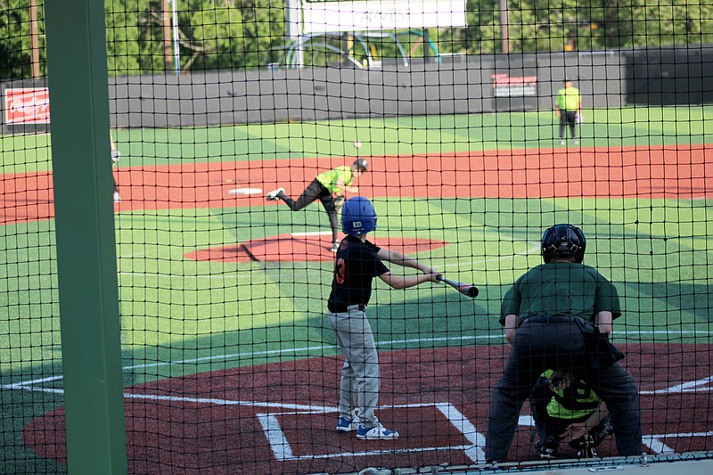 A player for the Express Employment Grizzlies watches the ball from the First Arkansas Insurance Lugnuts pitcher on Hank Aaron Field at Majestic Park in 2022. - Photo by James Leigh of The Sentinel-Record