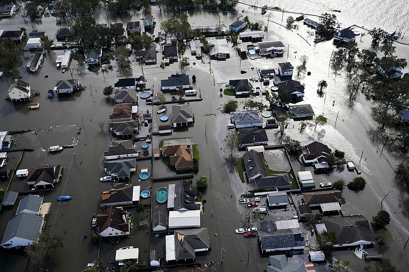 FILE - Homes are flooded in the aftermath of Hurricane Ida, Aug. 30, 2021, in Jean Lafitte, La. National Oceanic and Atmospheric Administration on Thursday, May 25, 2023, announced its forecast for the 2023 hurricane season.  (AP Photo/David J. Phillip, File)