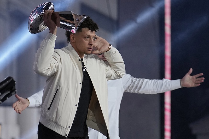 Kansas City Chiefs quarterback Patrick Mahomes holds up the Vince Lombardi Trophy during the first round of the NFL football draft, Thursday, April 27, 2023, in Kansas City, Mo. (AP Photo/Jeff Roberson)