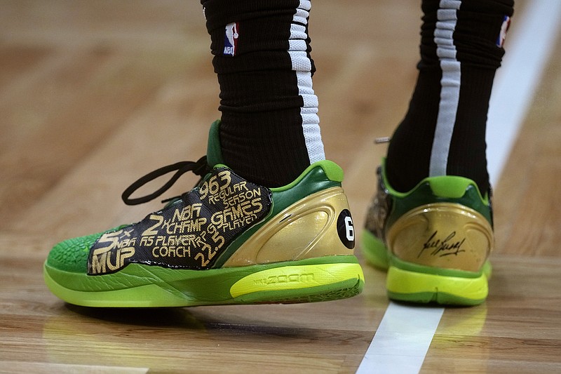 Boston Celtics guard Jaylen Brown wears shoes that feature an homage to Hall of Fame player Bill Russell during the first half in Game 5 of an NBA basketball Eastern Conference Final series against the Miami Heat Thursday, May 25, 2023, in Boston. (AP Photo/Charles Krupa )