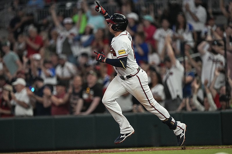 Atlanta Braves' Austin Riley reacts as he runs the bases after hitting his second home run of the game in the fifth inning of a baseball game against the Philadelphia Phillies, Thursday, May 25, 2023, in Atlanta. (AP Photo/John Bazemore)