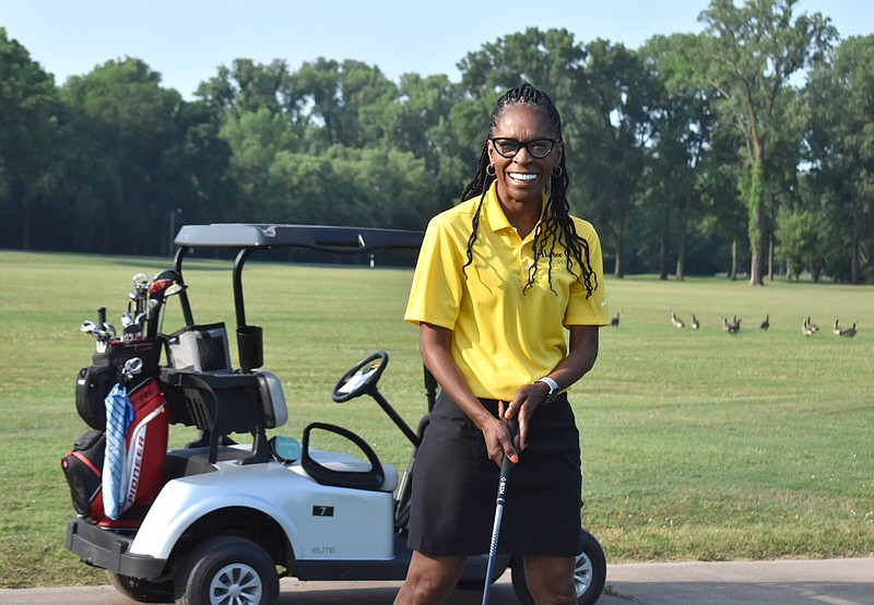 Pine Bluff Parks and Recreation director Trudy Redus smiles after taking the ceremonial tee shot at the grand re-opening of Harbor Oaks Golf Course on Friday morning. (Pine Bluff Commercial/I.C. Murrell)