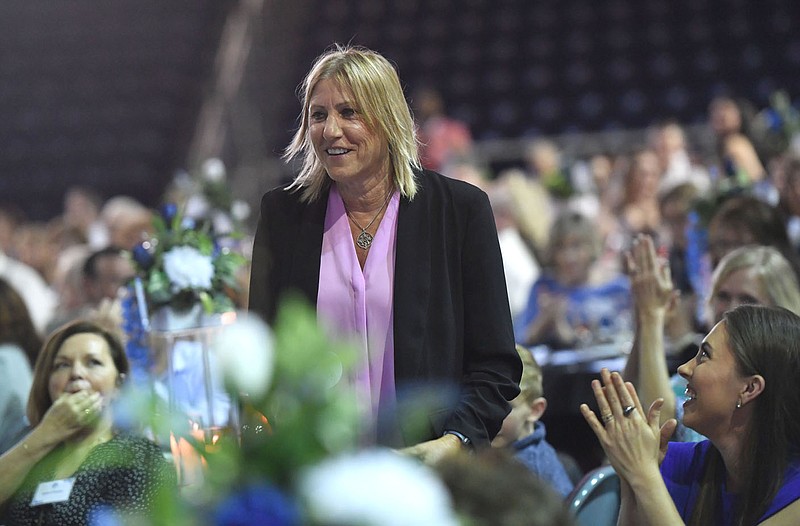 Jane Sargent, longtime University of Arkansas-Fort Smith volleyball coach, walks to the stage Tuesday, April 11, 2023, during the universitys Hall of Fame induction ceremony inside Gayle Kaundart Arena at the Stubblefield Center on the UAFS campus in Fort Smith. Visit nwaonline.com/photo for today's photo gallery. 
(NWA Democrat-Gazette/Andy Shupe)