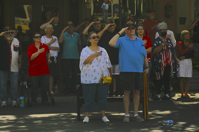 Local residents listen as the National Anthem is sung during the 2022 Memorial Day program in this News-Times file photo. This year's Memorial Day program is set for Monday, May 29, at 11 a.m.