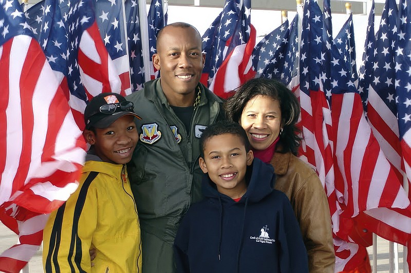 In this image provided by the U.S. Air Force, Col. CQ Brown, Jr., poses for a photo with his wife Sharene Brown, and sons, Sean and Ross, at the Nellis Air Force Base Air Show, in Nevada in 2006. Brown served as Weapons School Commandant from July 2005 to May 2007 at Nellis Air Force Base, Nevada. (U.S. Air Force via AP)