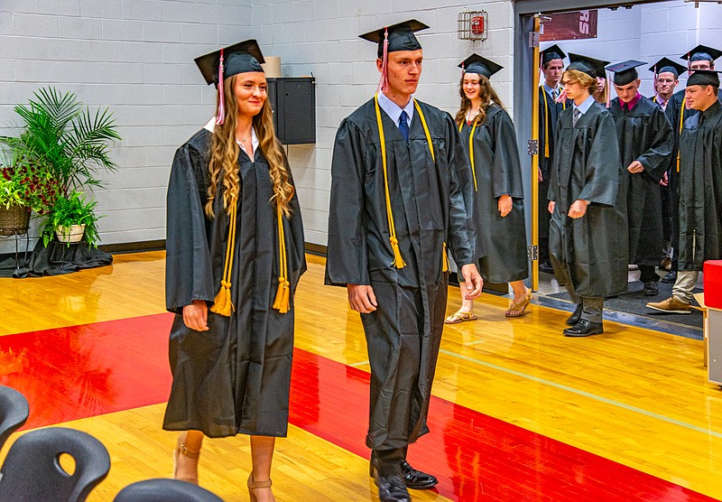 The senior class of 2023 processes in the Calvary Lutheran High School Gym for their commencement ceremony Saturday.  (Ken Barnes/News Tribune)