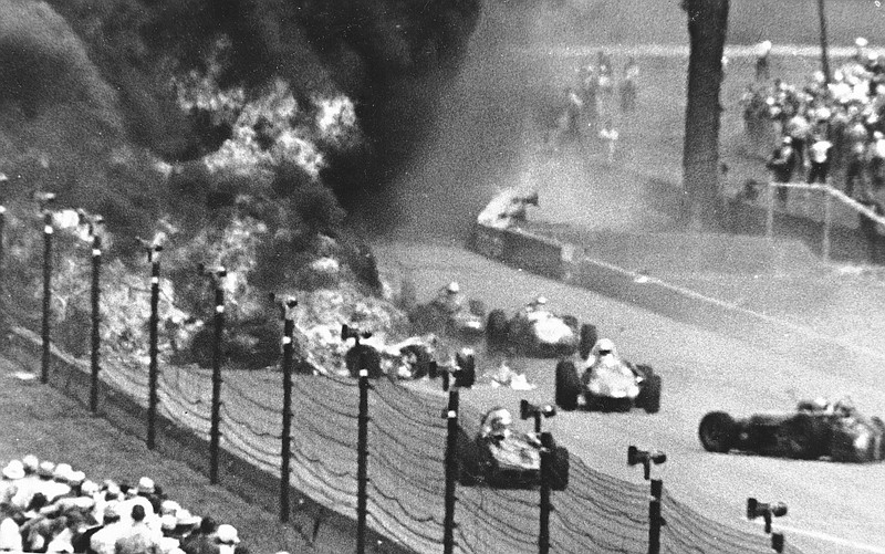 Drivers weave through blazing wreckage after a crash on the second lap of the Indianapolis 500 at Indianapolis Motor Speedway in Indianapolis on May 30, 1964. Eddie Sachs and Dave MacDonald were killed in the wreckage. - File photo by The Associated Press