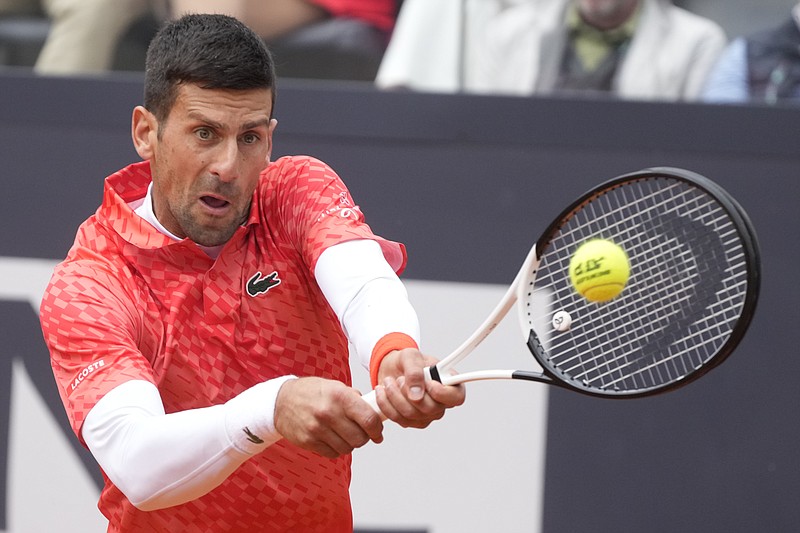 Serbia's Novak Djokovic returns the ball to Denmark's Holger Rune during their quarterfinal match at the Italian Open May 17 in Rome. - Photo by Gregorio Borgia of The Associated Press