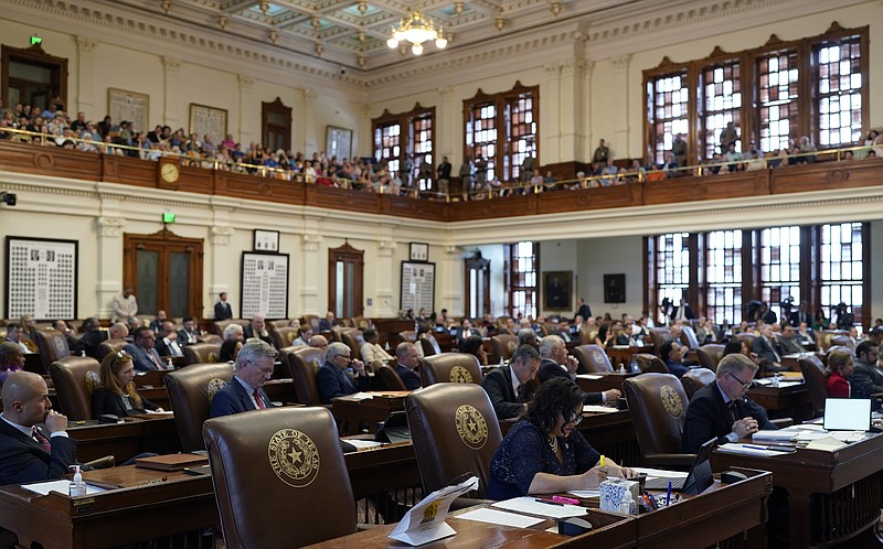 House members and visitors listen to the impeachment proceedings against state Attorney General Ken Paxton in the House Chamber at the Texas Capitol in Austin, Texas, Saturday, May 27, 2023. Texas lawmakers have issued 20 articles of impeachment against Paxton, ranging from bribery to abuse of public trust as state Republicans surged toward a swift and sudden vote that could remove him from office. (AP Photo/Eric Gay)