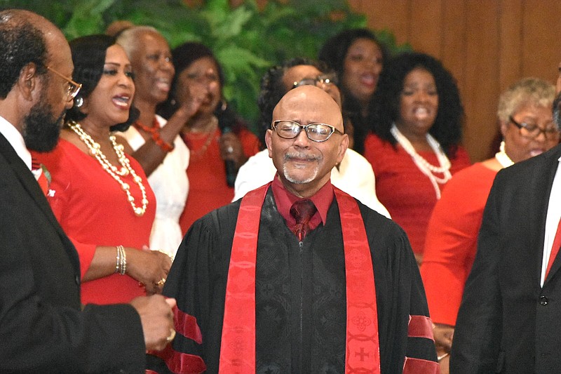 The Rev. Henry "Hank" Wilkins IV, a former Jefferson County judge and state senator, expresses emotion as the Phyllis Wilkins Memorial Choir sings a hymn during a funeral for Phyllis Wilkins, his wife, Saturday at Amos Chapel Missionary Baptist Church in Pine Bluff. (Pine Bluff Commercial/I.C. Murrell)