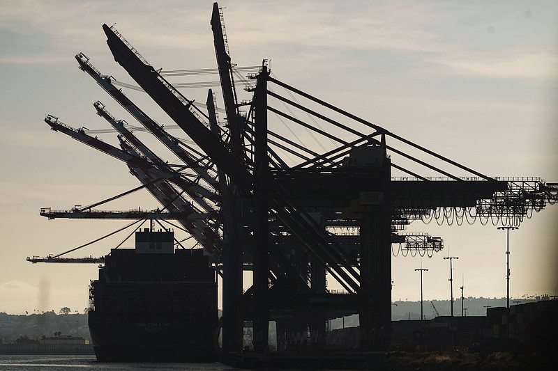 A docked container ship is seen at the Port of Los Angeles, Friday, April 28, 2023. A year ago, Los Angeles and Shanghai formed a partnership to create a green shipping corridor that would become a showcase for slashing planet-warming carbon emissions from the shipping industry, which produces about 3% of the world's total. The container shipping route is among the worlds busiest. (AP Photo/Damian Dovarganes)