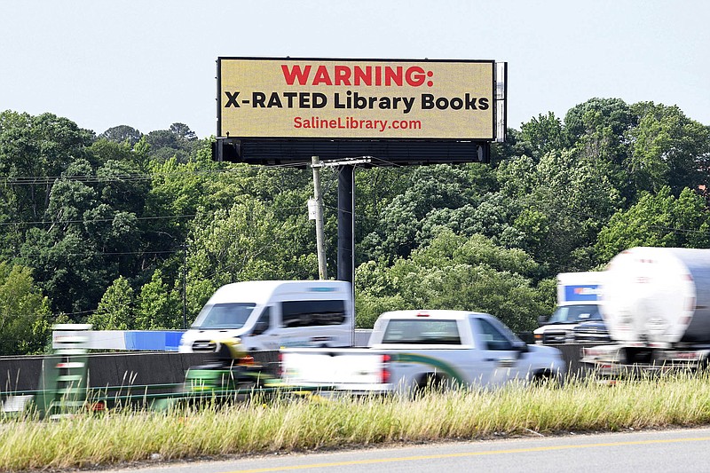 The Saline County Republican Committee billboards decrying “x-Rated library books” stand on display over I-30 in Benton near the local Walmart on Friday, May 26, 2023.

(Arkansas Democrat-Gazette/Stephen Swofford)