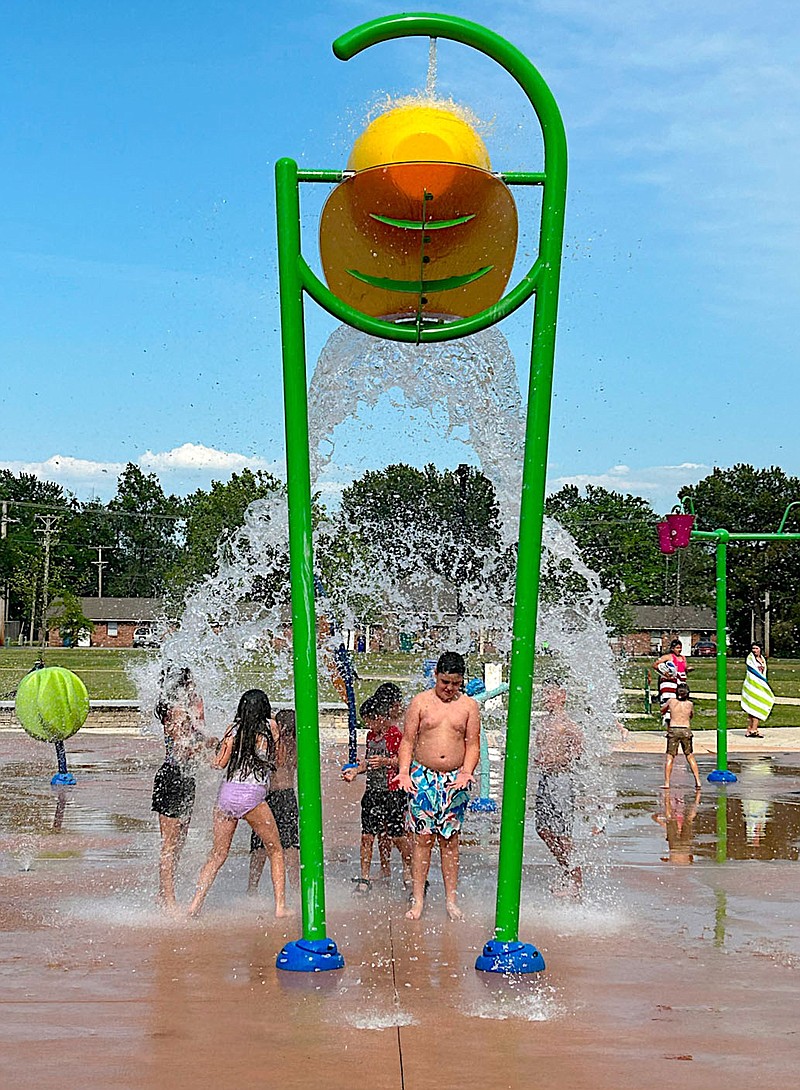 Randy Moll/Westside Eagle Observer
The splash pad in Gentry's city park on Main Street opened last week and children enjoyed the watery attraction Sunday afternoon. Admission to the splash pad is free. Hours are from 9 a.m. until 8 p.m. daily.