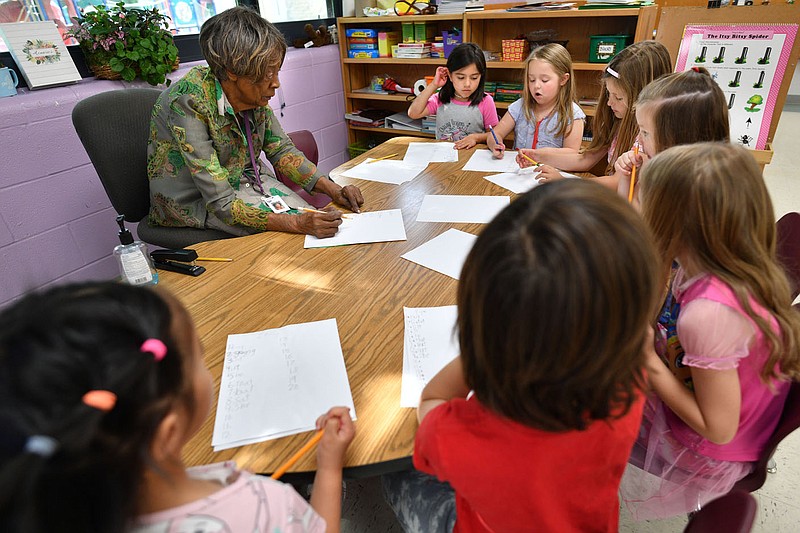 Thelma Thomason, a kindergarten teacher at Vandergriff Elementary School, teaches reading skills Friday, May 26, 2023, with members of her class in her classroom at the school. Thomason is retiring after teaching in the district since the 1961-62 school year. Visit nwaonline.com/photo for today's photo gallery. 
(NWA Democrat-Gazette/Andy Shupe)