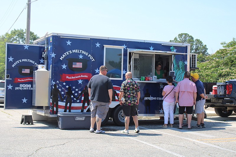 Photo By: Michael Hanich
Customers line up at Mate's Melting Pot at the Food Truck Festival.