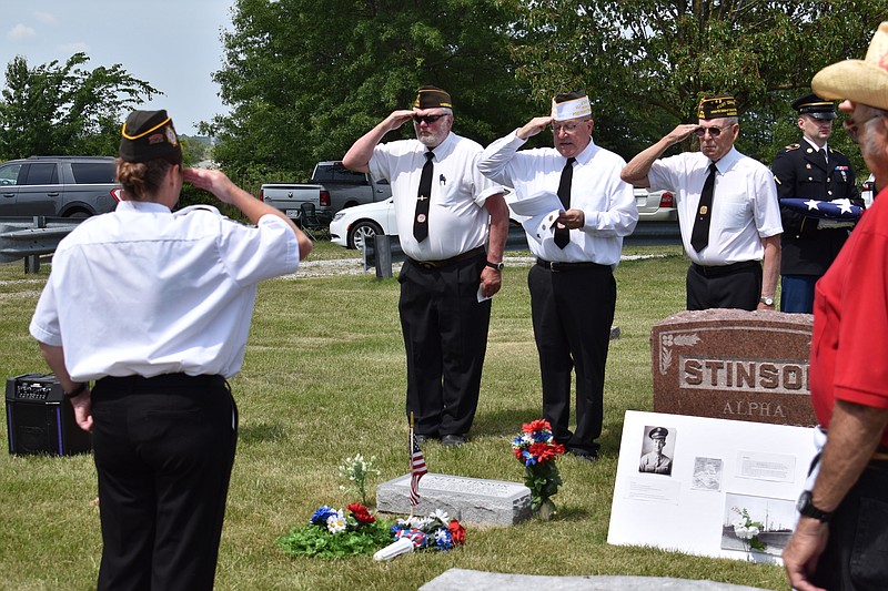 Democrat photo/Garrett Fuller — Members of Veterans of Foreign Wars Post 4345, California, salute Monday in Clarksburg's Hickman Cemetery after leaving offerings at the headstone of Ned Stinson, a U.S. Army soldier who lost his life Nov. 27, 1943, aboard the HMT Rohna after it was attacked by a German glide bomb.