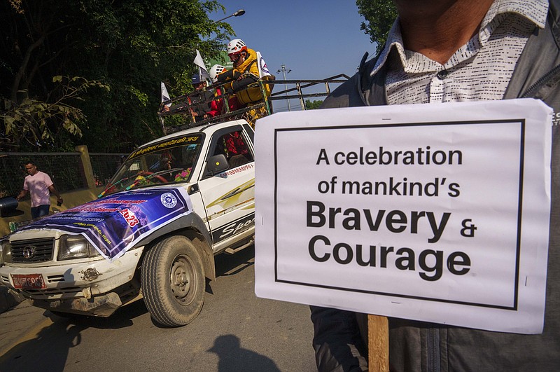People from the mountaineering community, Sherpa guides and officials participate in a rally to mark the 70 anniversary of the first ascent of Mount Everest in Kathmandu, Nepal, Monday, May 29, 2023.  The 8,849-meter (29,032-foot) mountain peak was first scaled by New Zealander Edmund Hillary and his Sherpa guide Tenzing Norgay on May 29, 1953. (AP Photo/Niranjan Shrestha)