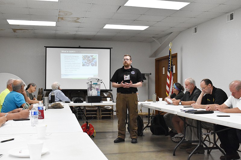 Democrat photo/Garrett Fuller — Matthew Brown, center, of the Boone County Office of Emergency Management, explains what a Community Emergency Response Team (CERT) is at an informative meeting Monday at the Jamestown Community Building. Members of the Moniteau County Crime Watch organization, who hosted the meeting, hope to start a CERT in Moniteau County.