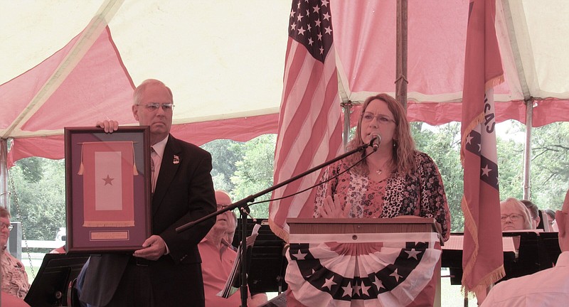 April Brandon (right) was the Gold Star speaker at Monday mornings Memorial Day Ceremony on the White Hall Museum's grounds. Her husband was SSG Stacey C. Brandon, one of many who died for his country. David Beck (left) White Hall City Council member, was the master of ceremony. (Special to The Commercial)