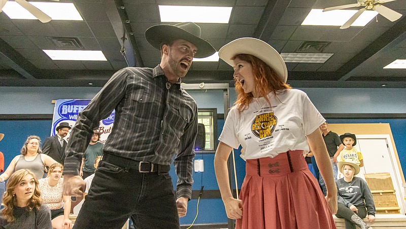 Josh Cobb/News Tribune photo: Taylor Sinclare as Frank Butler and Natalie Newberry as Annie Oakley rehearse for the play "Annie Get Your Gun" during The Little Theatre's rehearsal on Thursday, May 25, 2023.