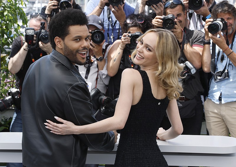 Abel Tesfaye, left, and Lily-Rose Depp pose for photographers at the photo call for the television series 'The Idol' at the 76th international television series festival, Cannes, southern France, Tuesday, May 23, 2023. (Photo by Joel C Ryan/Invision/AP)