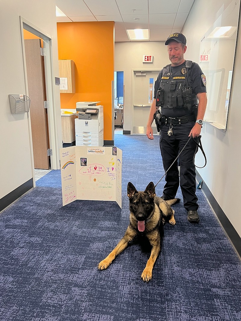 Photo courtesy of Fulton Police Department
Fulton Police Department Officer, Will McCaulley, with Fulton Police Department K-9, Bo, at the police department after receiving a thank you card from the Fulton Park's and Recreation department.