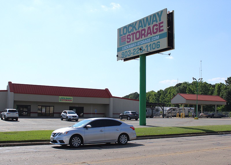A car passes in front of Lockaway Storage on Wednesday afternoon, May 31, 2023, in Texarkana, Texas. An early-morning fire at the Robison Road business is being investigated as a possible arson. (Staff photo by Stevon Gamble)