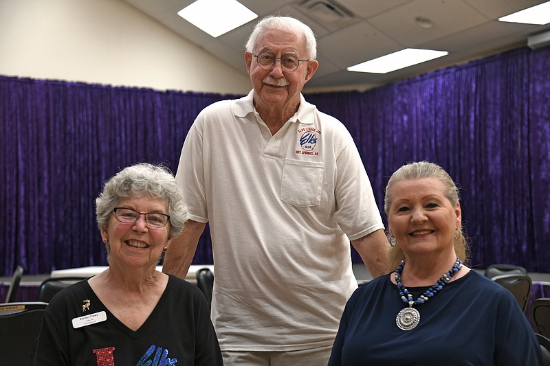 Herb Carey, center, Arkansas State Elks Association first vice president, is shown with his wife, Kacky, left, and Ginger Yates, ASEA state public relations officer. - Photo by Lance Brownfield of The Sentinel-Record.