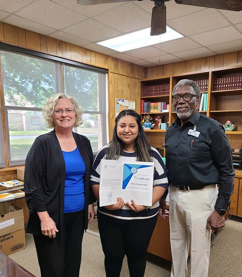 The VITA Center presentation included Judy Rudd (from left), pastor at Lakeside United Methodist Church; recipient Vanessa Hernandez-Valdez of MiCasa Hispanic Ministry at Lakeside; and the Rev. Jesse C. Turner, executive director of Pine Bluff Interested Citizens for Voter Registration Inc. (Special to The Commercial)