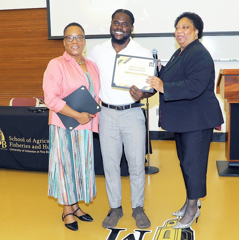 The presentation included Alicia Robinson-Farmer (left) Danniel Diquan Bailey and Tracy V. Dunbar at a spring luncheon for graduates of the UAPB School of Agriculture, Fisheries and Human Sciences. (Special to The Commercial/University of Arkansas at Pine Bluff)