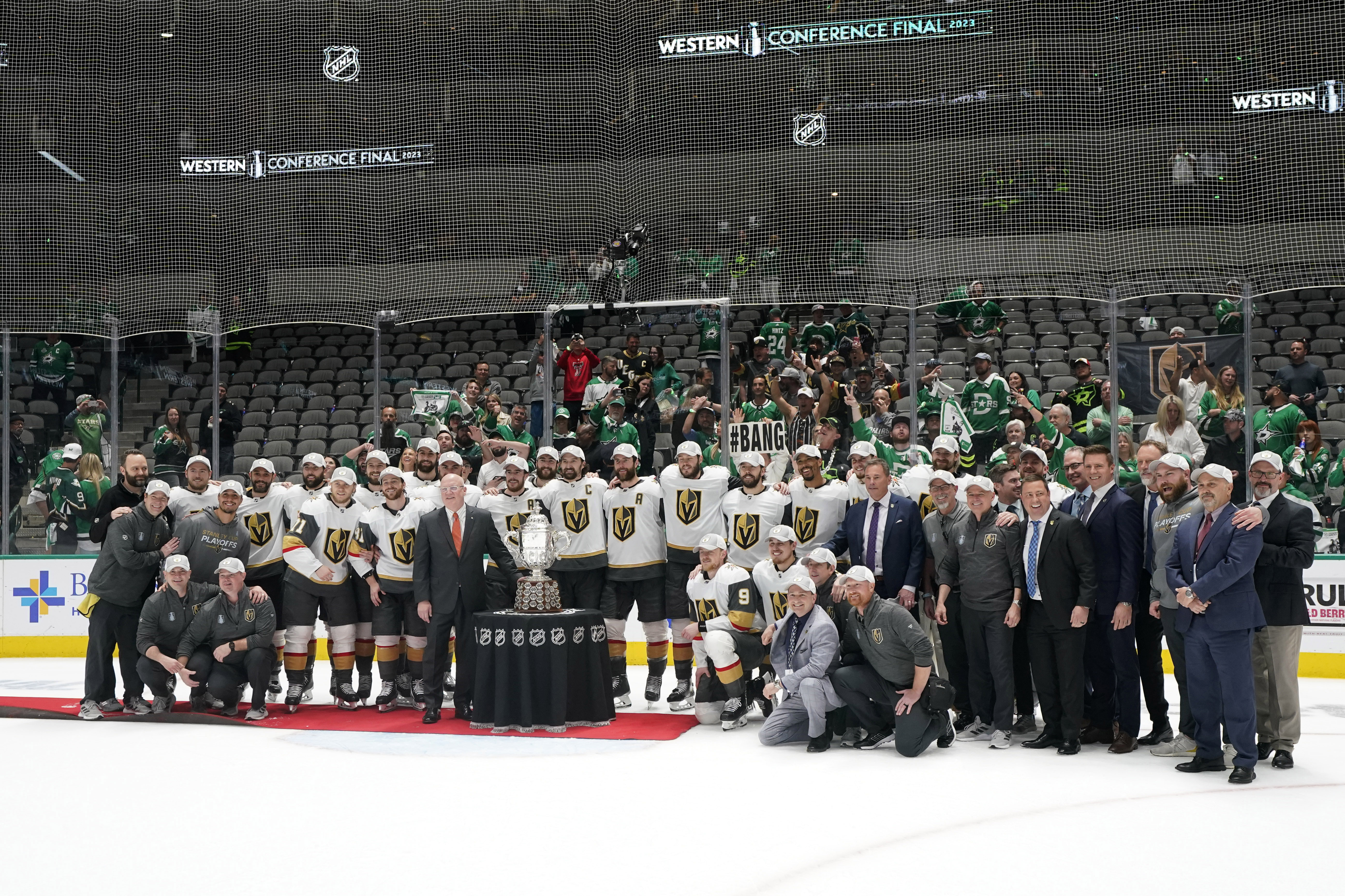 From left to right, Bill Daly, deputy commissioner of the NHL, presents the  trophy to Vegas Golden Knights' Reilly Smith, Mark Stone and Alex  Pietrangelo following the team's win over the Dallas