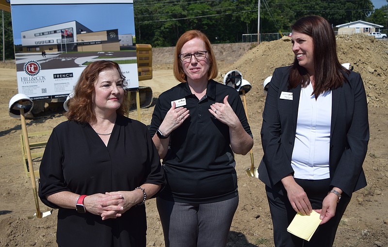 Hot Springs School Superintendent Stephanie Nehus, center, talks about the impact of the construction of a new school following Wednesdays groundbreaking ceremony, as Hot Springs School Board President Ann Hill, left, and Hot Springs World Class High School Principal Kiley Simms look on.  - Photo by Donald Cross of The Sentinel-Record