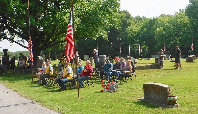 Susan Holland/Westside Eagle Observer
A small crowd begins to gather at Hillcrest Cemetery just before the beginning of Gravette's annual Memorial Day ceremony Monday, May 29. Army veteran Robert Honderich was speaker for this year's observance, organized each year by John E. Tracy American Legion Post 25.