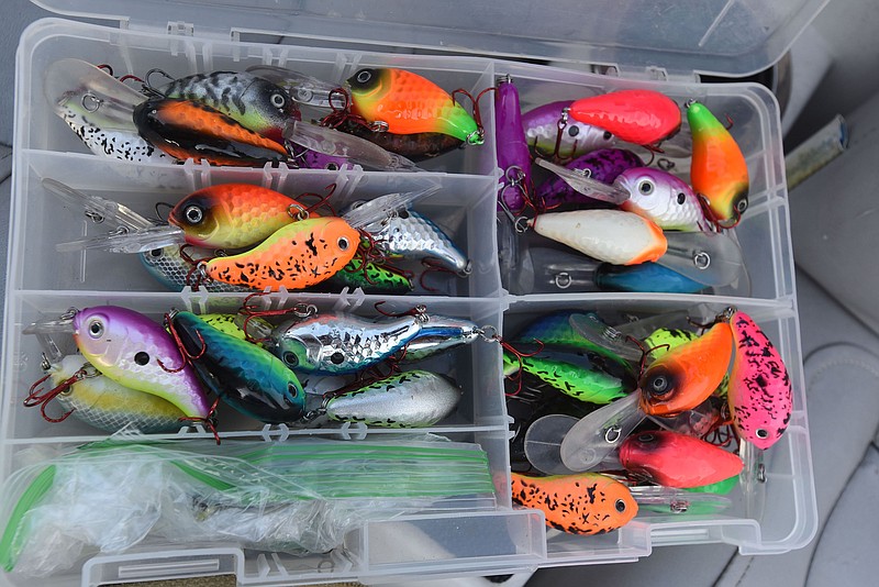 Mitch Glenn, owner of Pico Lures in Garfield, keeps several colors of crank baits handy when trolling for crappie. (NWA Democrat-Gazette File Photo/Flip Putthoff)